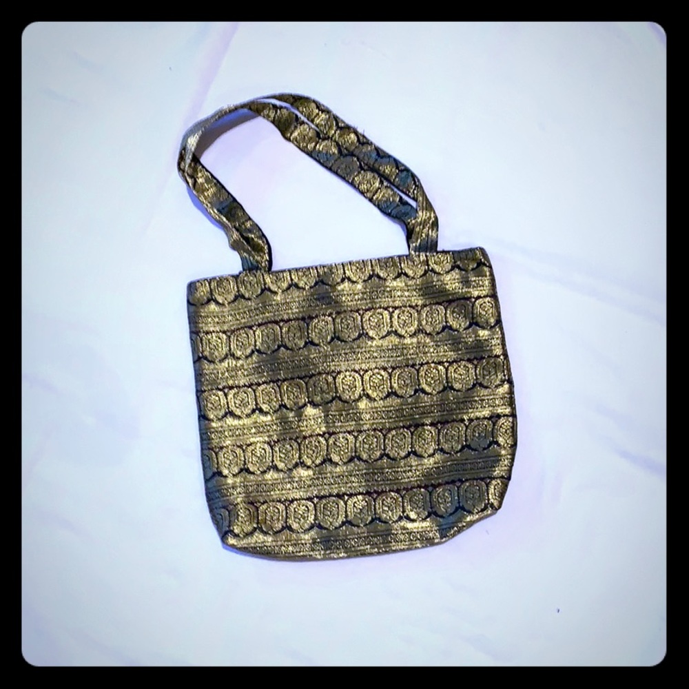 Hand sewn one of a kind silk bag.